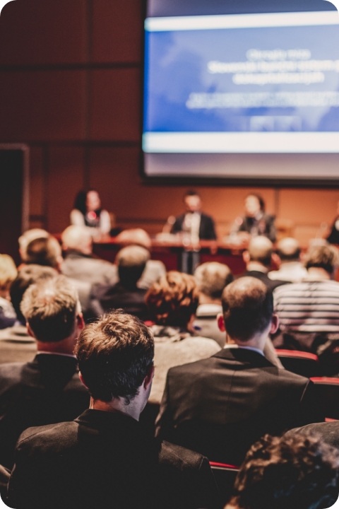 Audience listening to a speaker at the ITOP Forum